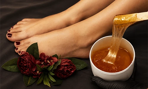 Warm wax being applied to skin